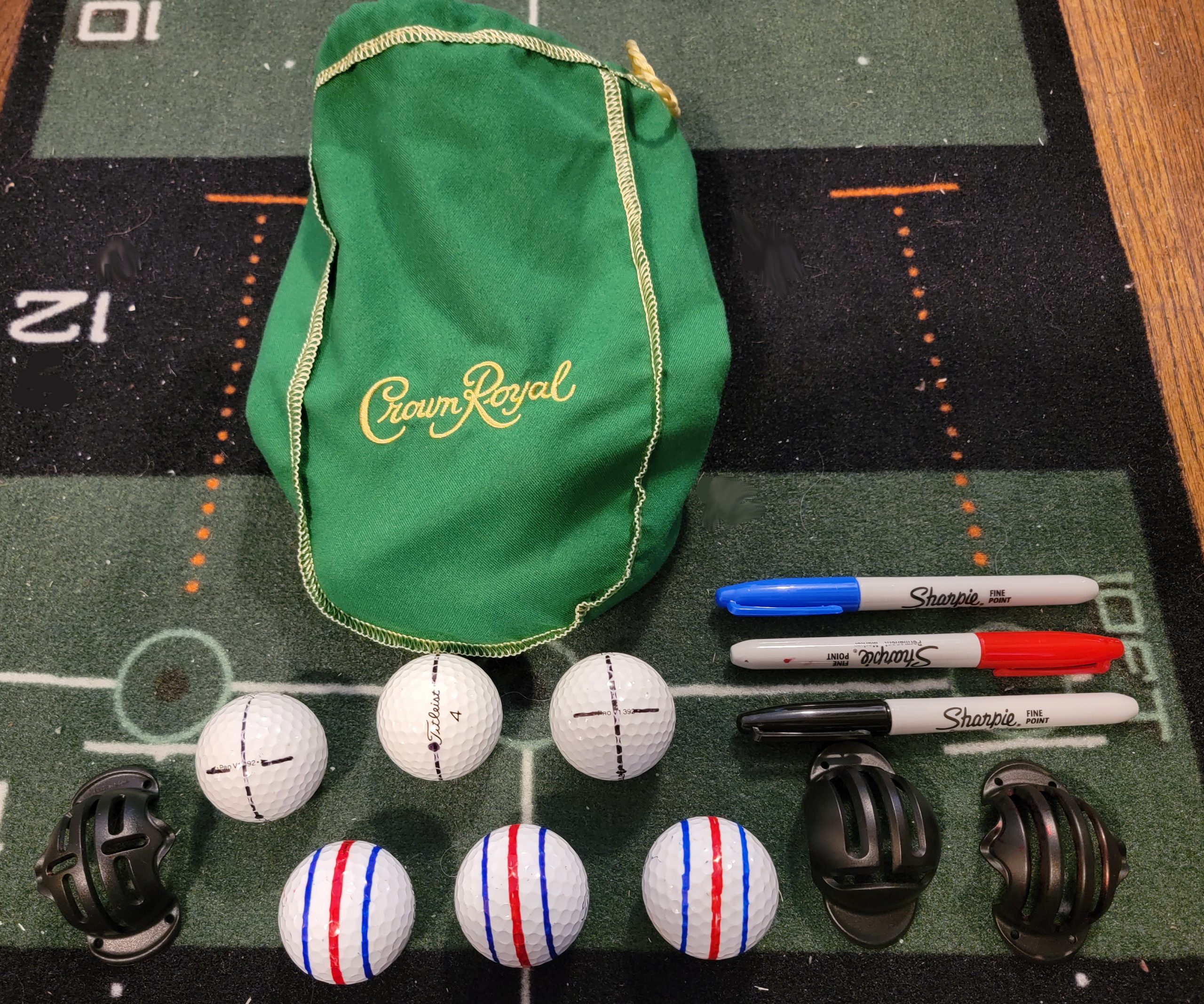 Old Duffer Golf image of lined golf balls for indoor putting drills: aim