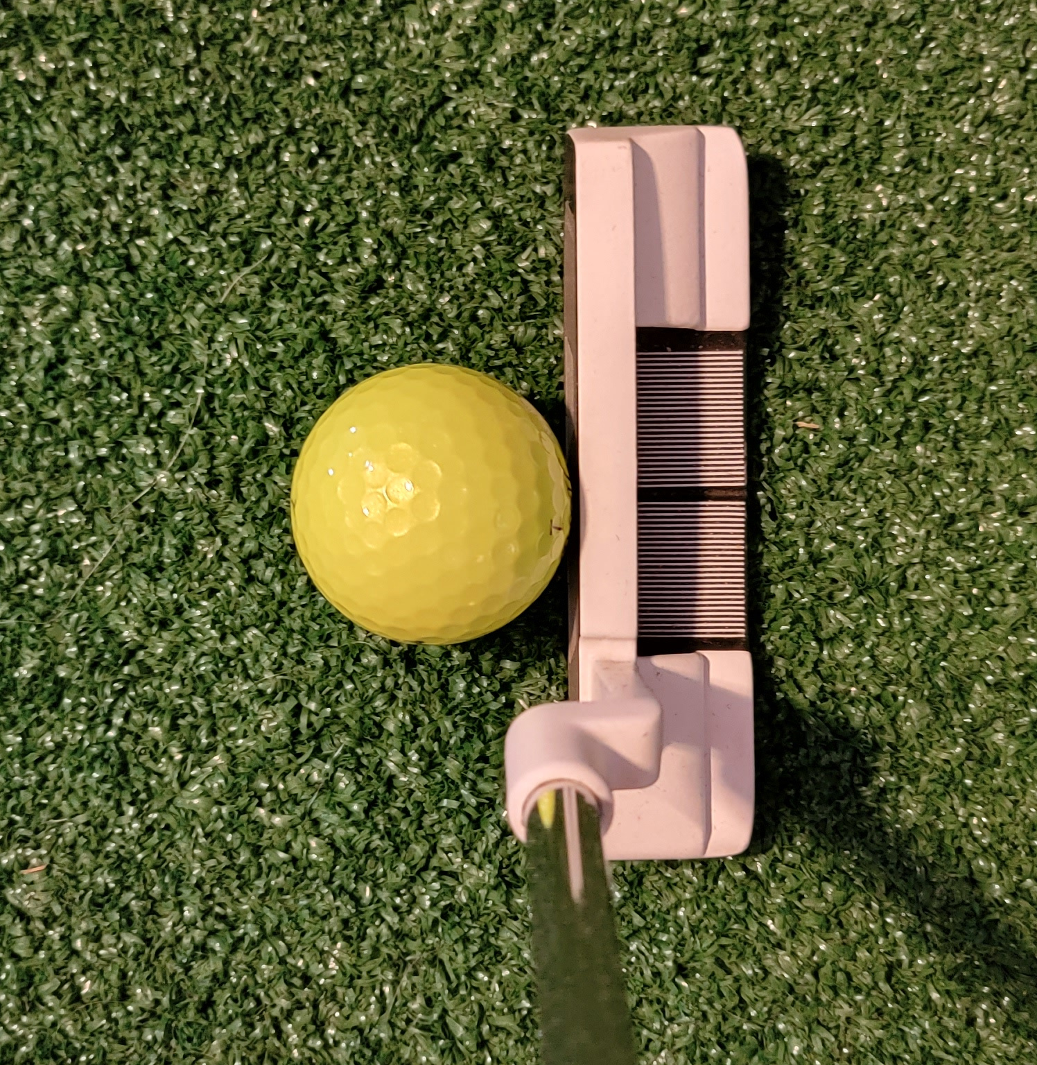 Old Duffer Golf image of downhill putts ball aligned center