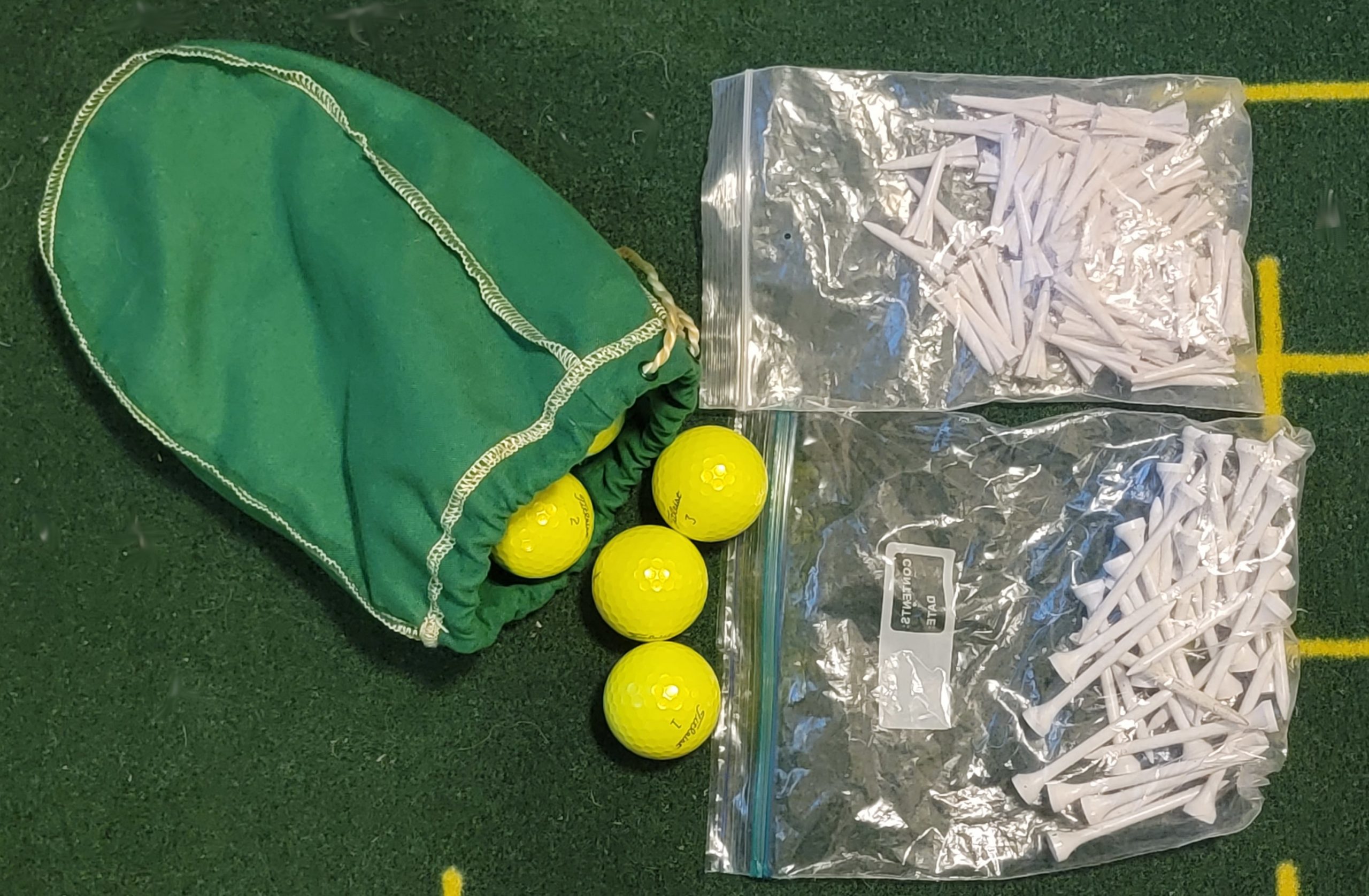 Old Duffer Golf image of extra golf balls and tees