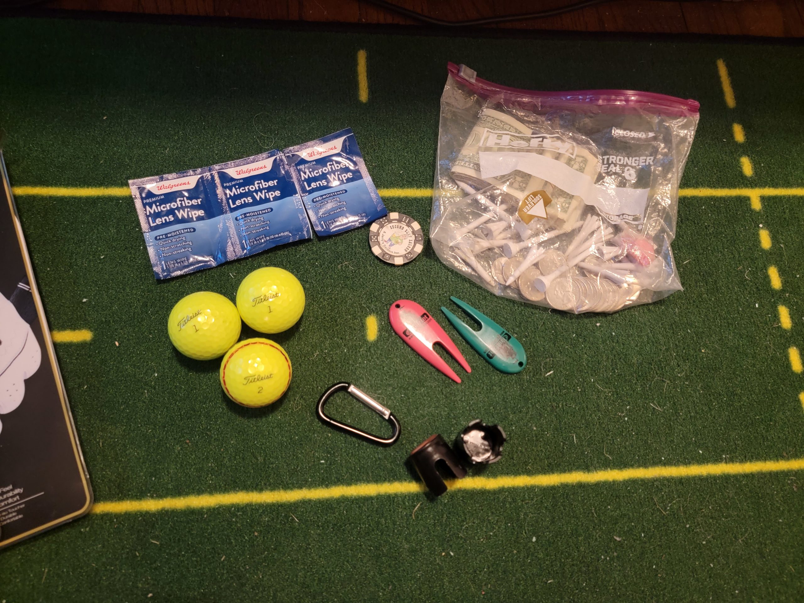 Old Duffer Golf image of stuff I keep in the top pocket of my golf bag