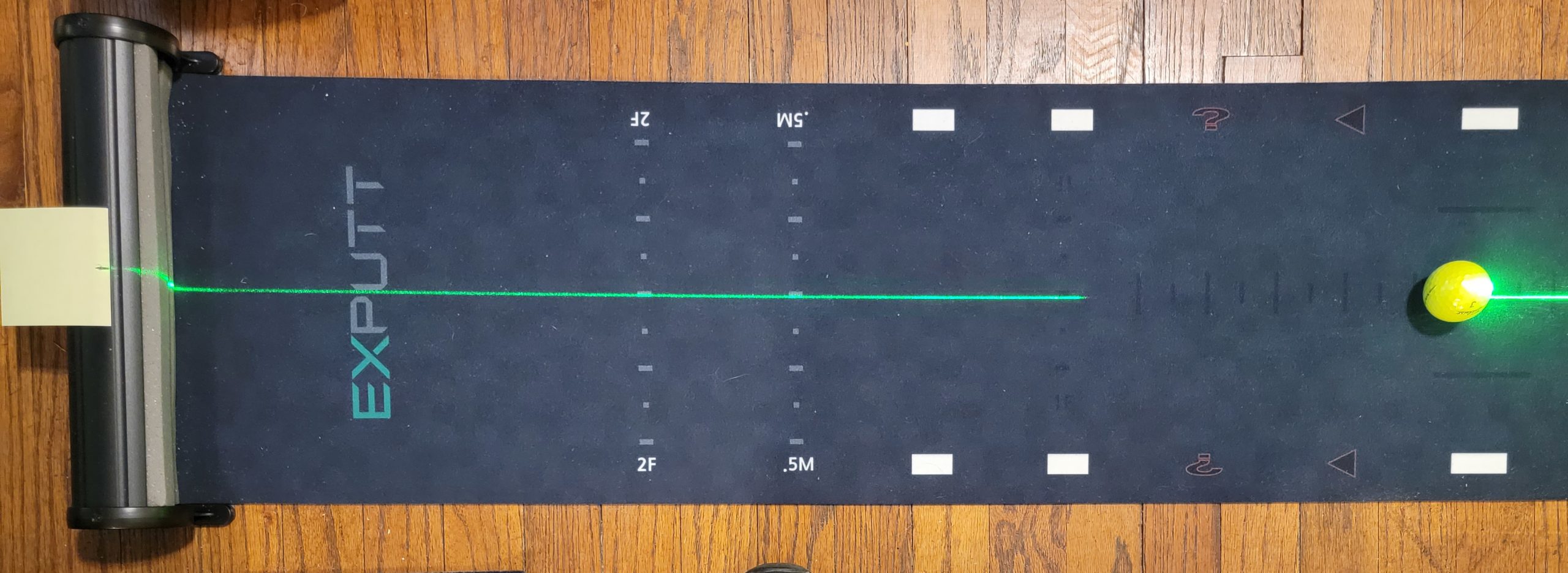 Old Duffer Golf image of a laser line on the EXPUTT mat