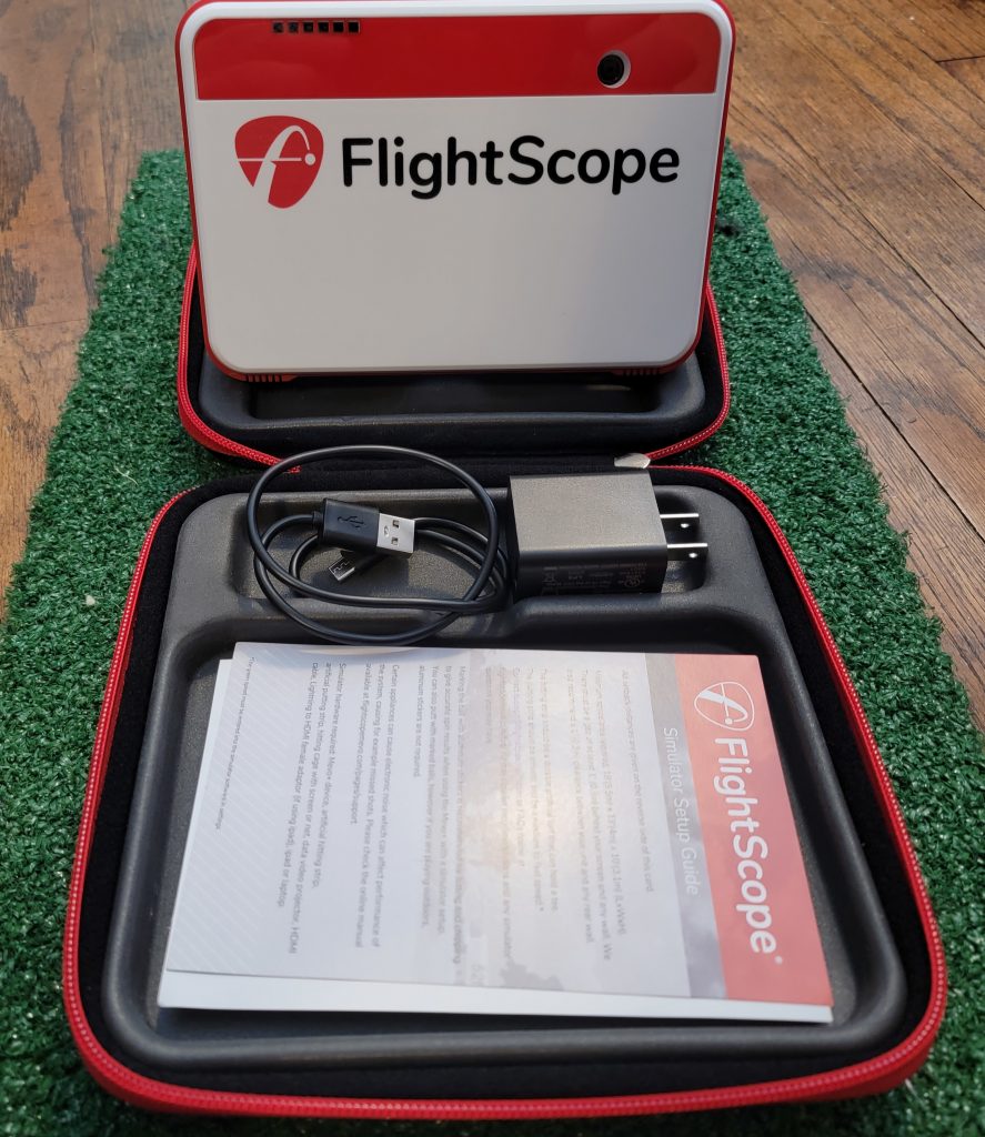 Old 'Duffer Golf image of a FlightScope Mevo+ 2023 and hard case.